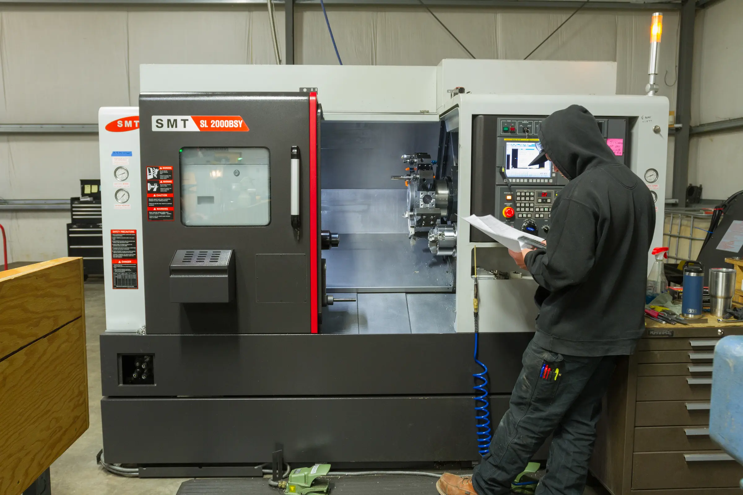 Worker at CNC machine