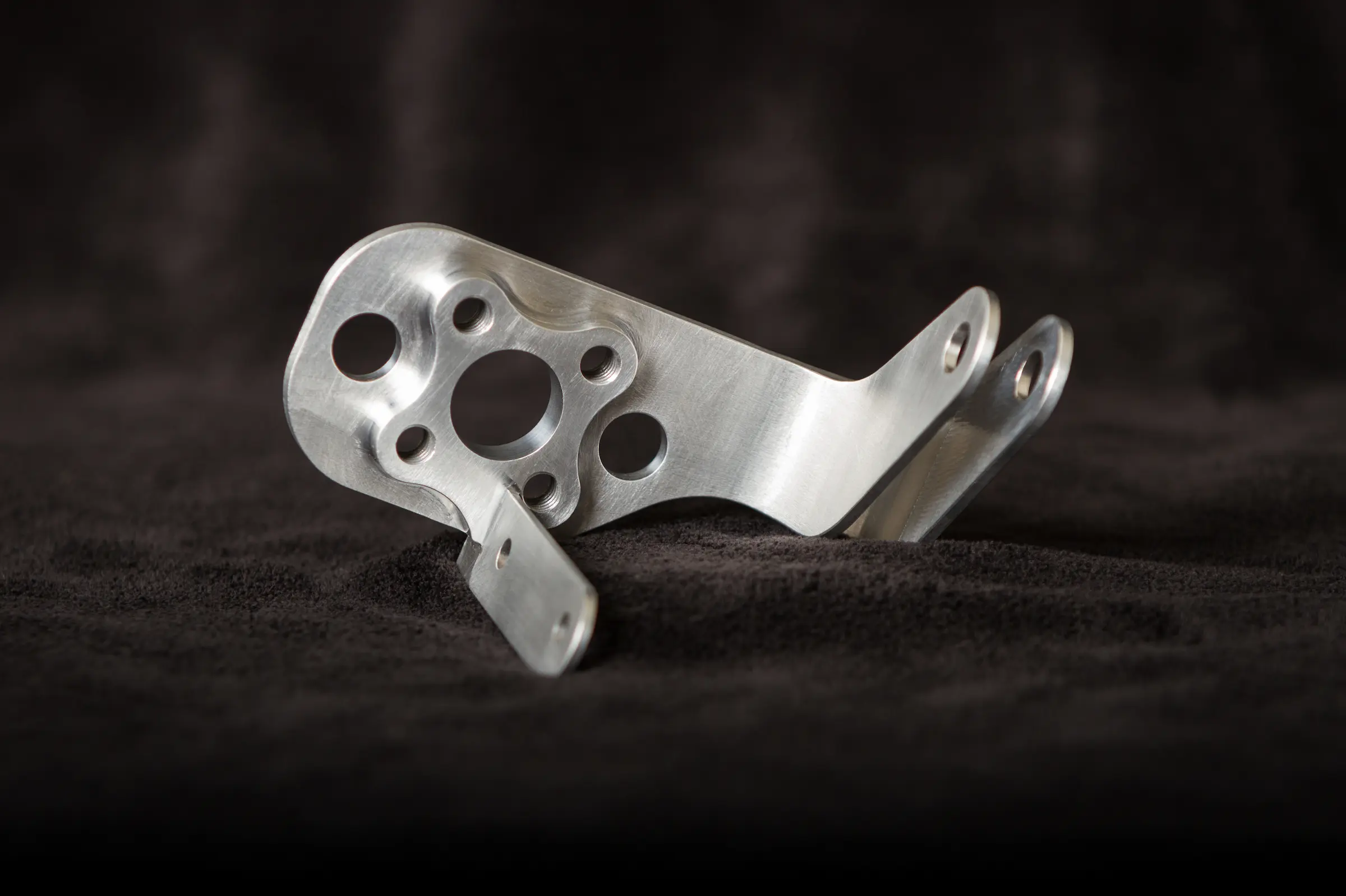 Machined bracket with circular holes